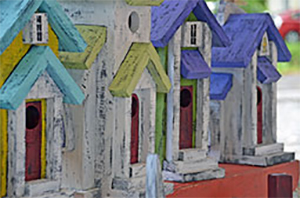 row of colorful birdhouses